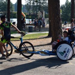 Cyclist Pulling Rider Athlete During Race